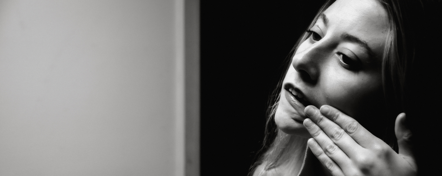 girl in mirror in black and white