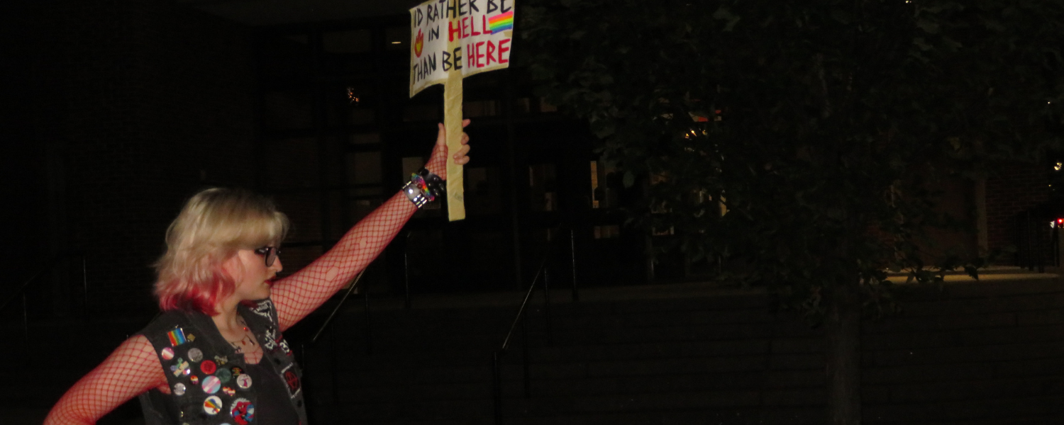Woman holding a sign