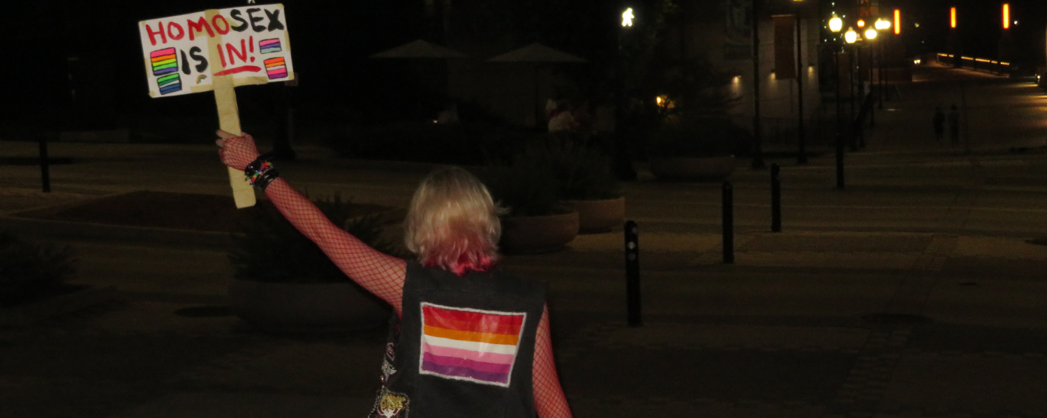 Woman holding a sign