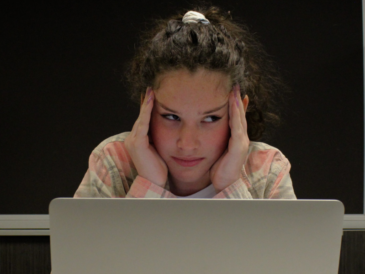 girl frustrated in front of computer