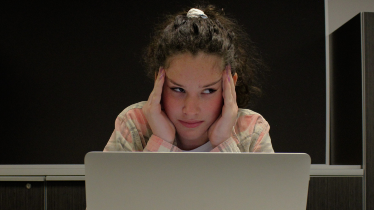 girl frustrated in front of computer