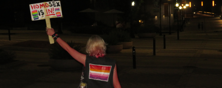 Woman holding a sign