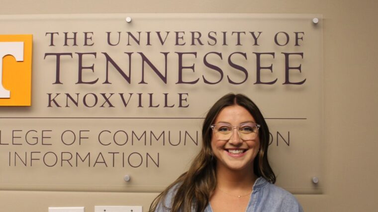 Gabby DePietro in front of CCI sign