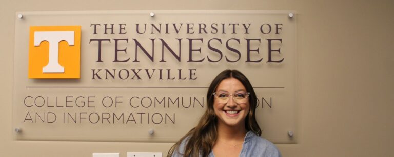 Gabby DePietro in front of CCI sign