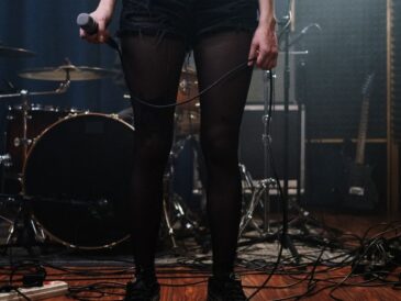 Woman holding a microphone.