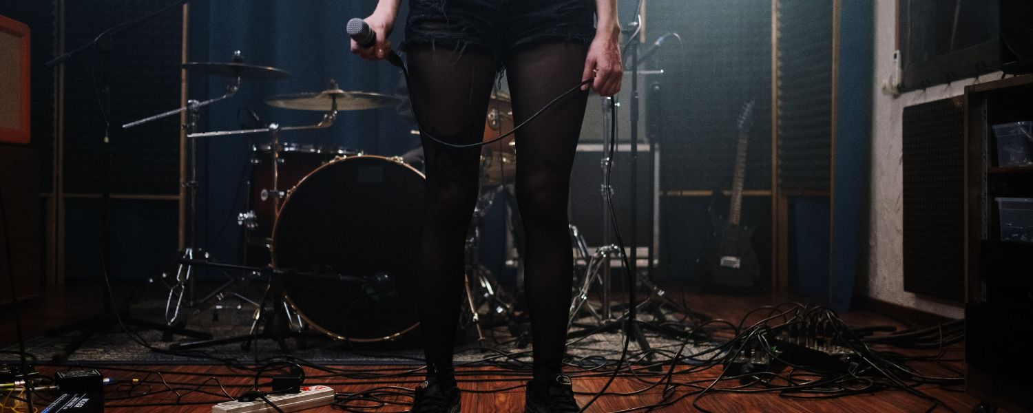 Woman holding a microphone.